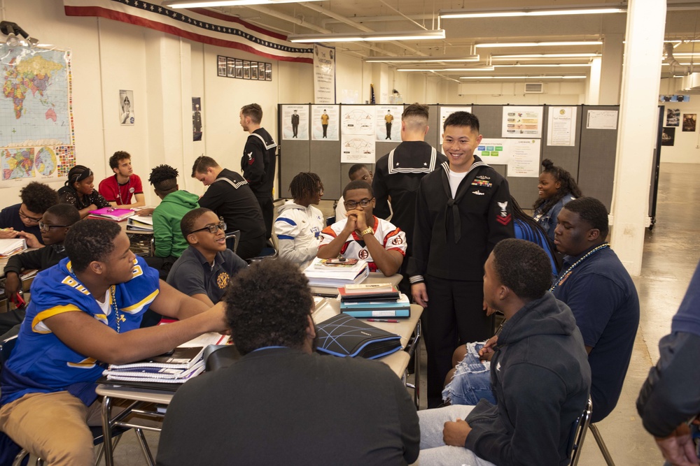 Sailors and Civilians Race Calculator Robots With Baltimore NJROTC