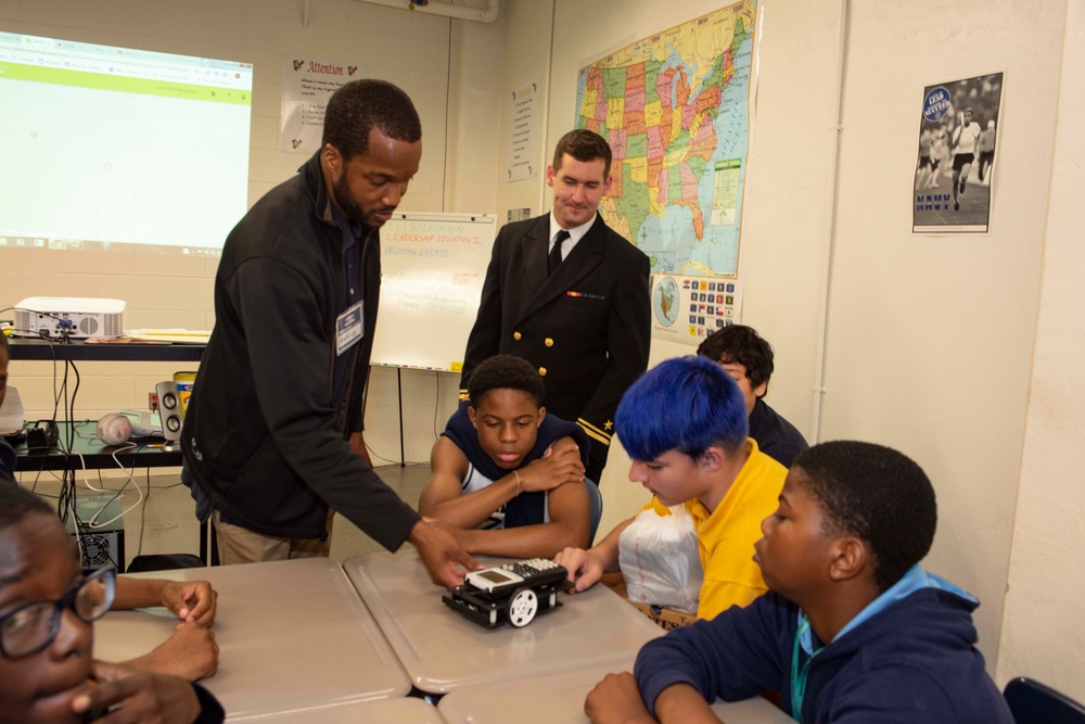 Sailors and Civilians Race Calculator Robots With Baltimore NJROTC