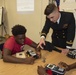 Sailors and Civilians Race Calculator Robots With Baltimore NJROTC