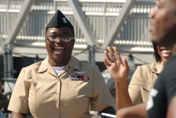 Sister-in-laws share a touching moment aboard the USS Wisconsin (BB-64)