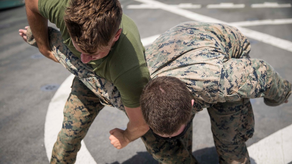 Marines in the Non-Lethal Course take part in the OC Spray Confidence Course