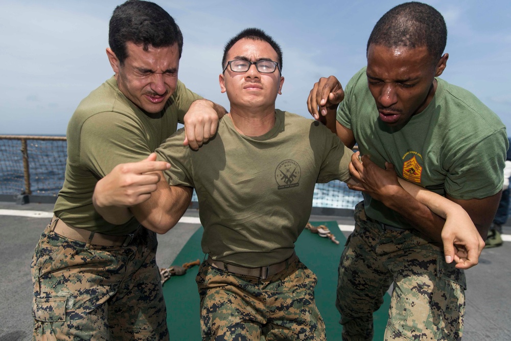 Marines in the Non-Lethal Course take part in the OC Spray Confidence Course