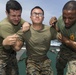 Marines in the Non-Lethal Course take part in the OC Spray Confidence Course