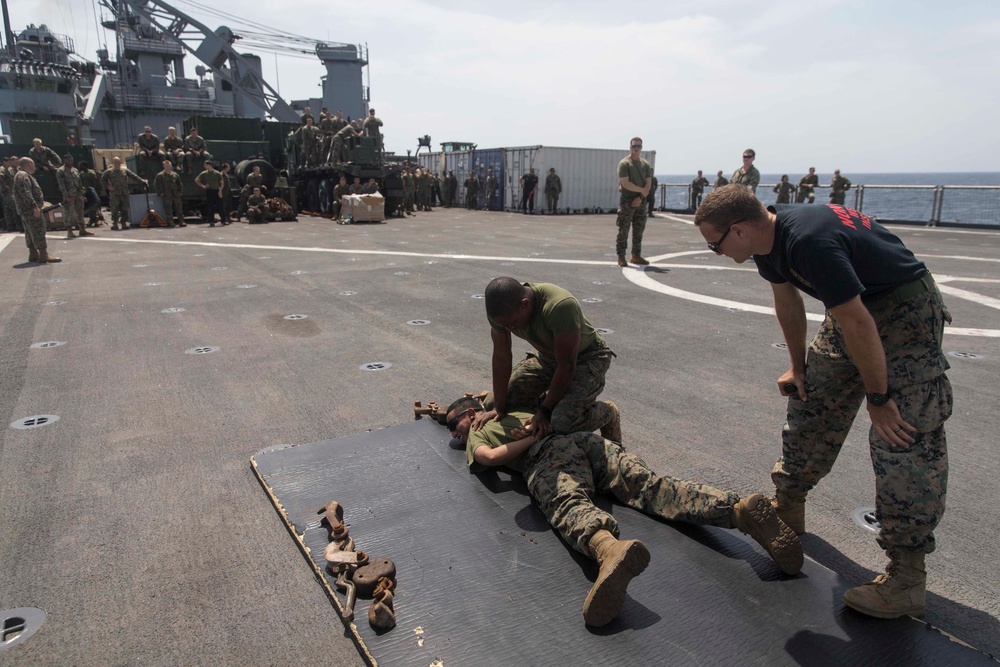 Marines in the Non-Lethal Course take part in the OC Spray Confidence Course