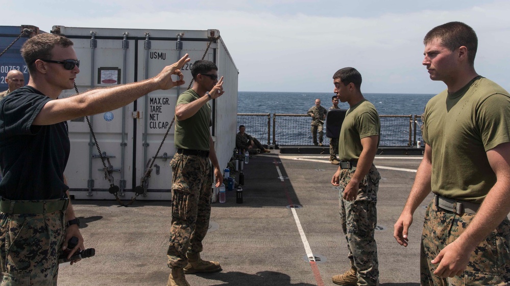 Marines in the Non-Lethal Course take part in the OC Spray Confidence Course