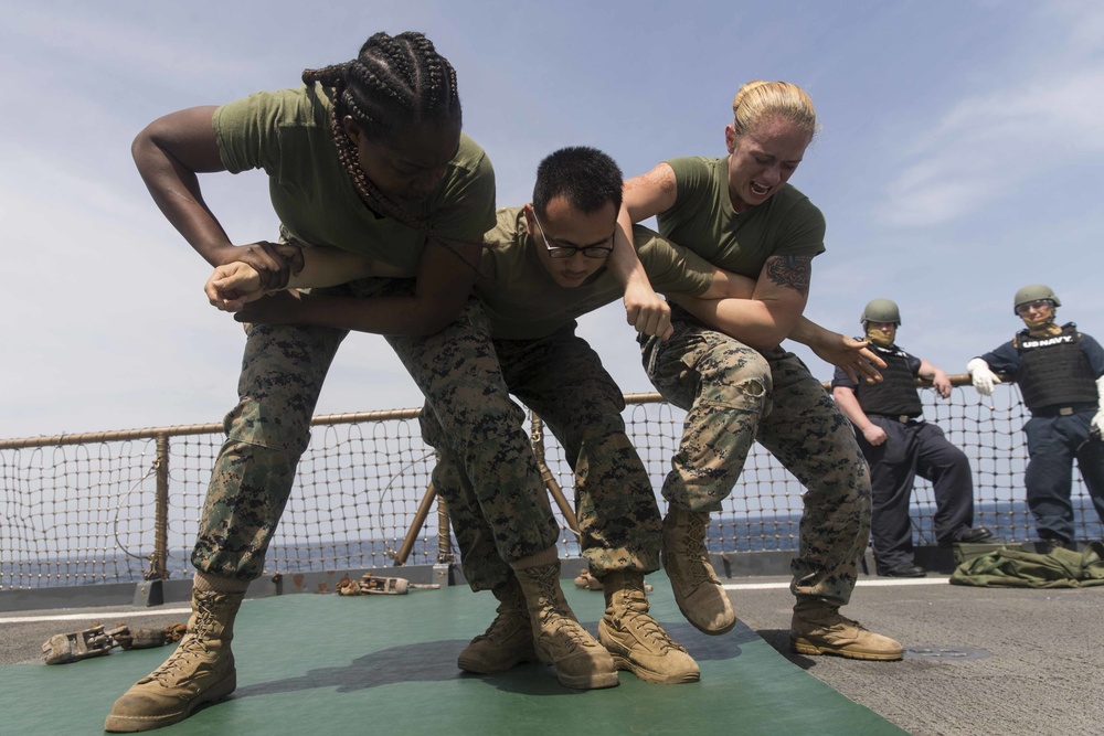 Marines in the Non-Lethal Course take part in the OC Spray Confidence Course