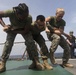 Marines in the Non-Lethal Course take part in the OC Spray Confidence Course