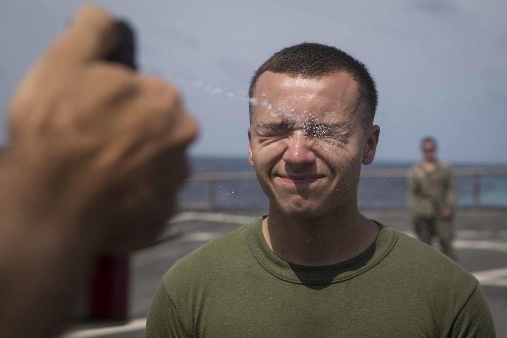 Marines in the Non-Lethal Course take part in the OC Spray Confidence Course