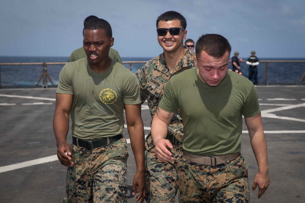 Marines in the Non-Lethal Course take part in the OC Spray Confidence Course