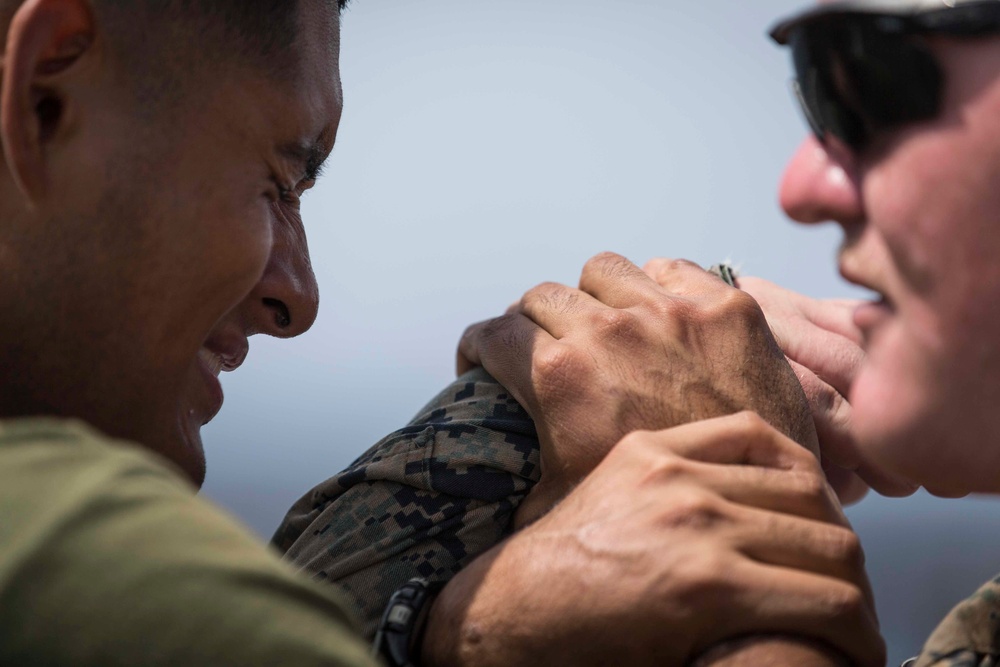 Marines in the Non-Lethal Course take part in the OC Spray Confidence Course