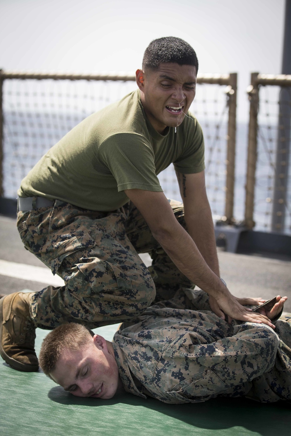 Marines in the Non-Lethal Course take part in the OC Spray Confidence Course