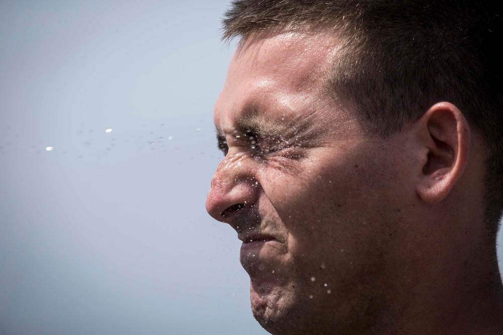 Marines in the Non-Lethal Course take part in the OC Spray Confidence Course