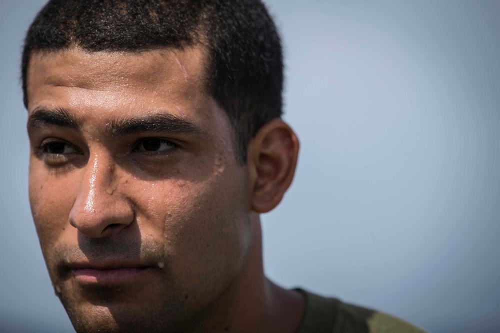 Marines in the Non-Lethal Course take part in the OC Spray Confidence Course