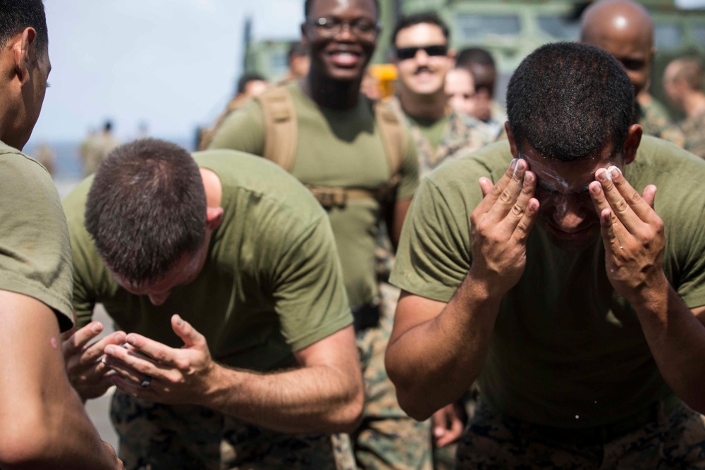 Marines in the Non-Lethal Course take part in the OC Spray Confidence Course