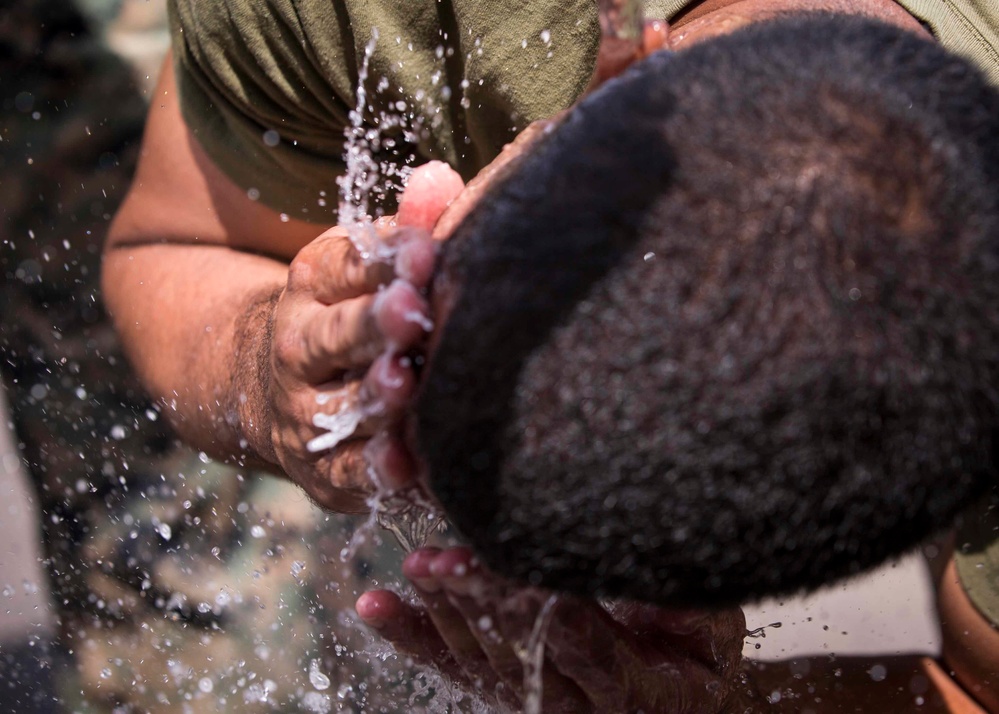 Marines in the Non-Lethal Course take part in the OC Spray Confidence Course