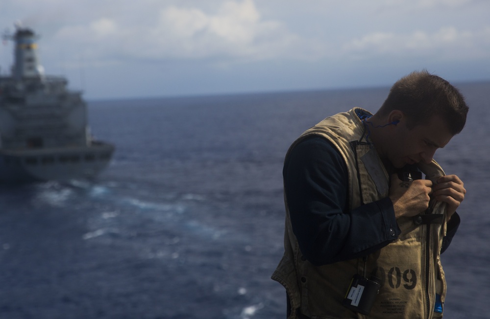 USS Iwo Jima recieves a resupply at sea