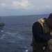 USS Iwo Jima recieves a resupply at sea