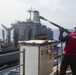 USS Iwo Jima recieves a resupply at sea