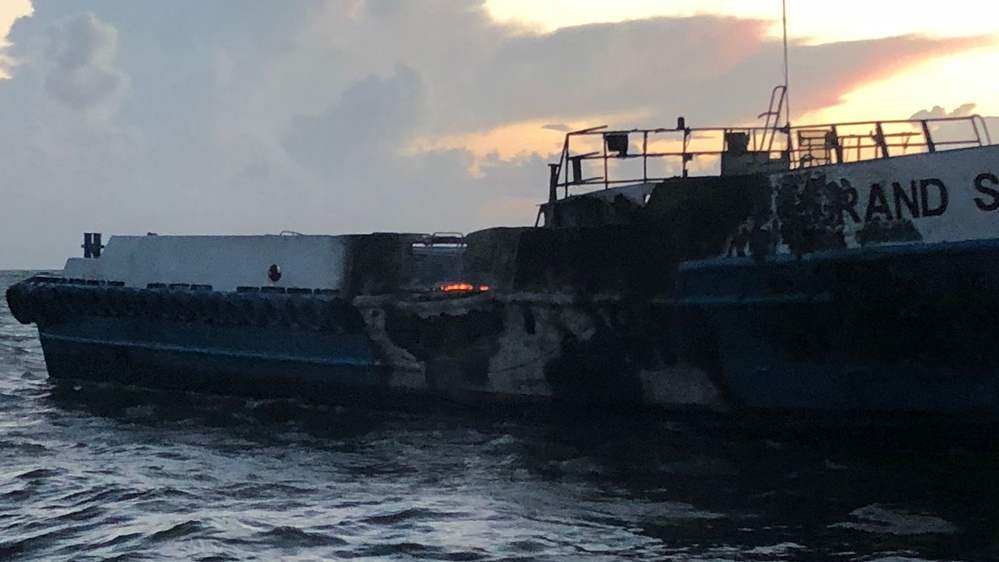 Coast Guard rescues 4 people from burning vessel