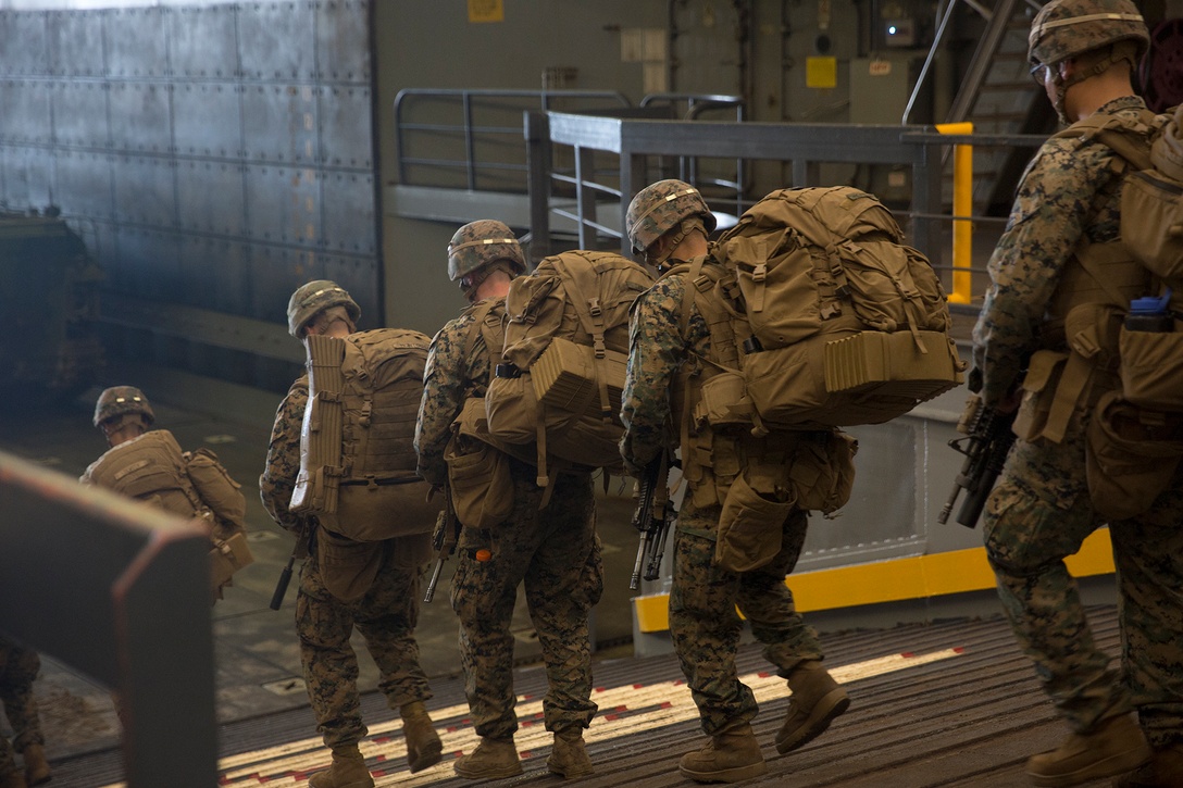 U.S. Marines with Easy Company, 2nd Battalion, 2nd Marine Regiment, 2nd Marine Division particapate in a amphibious beach landing.