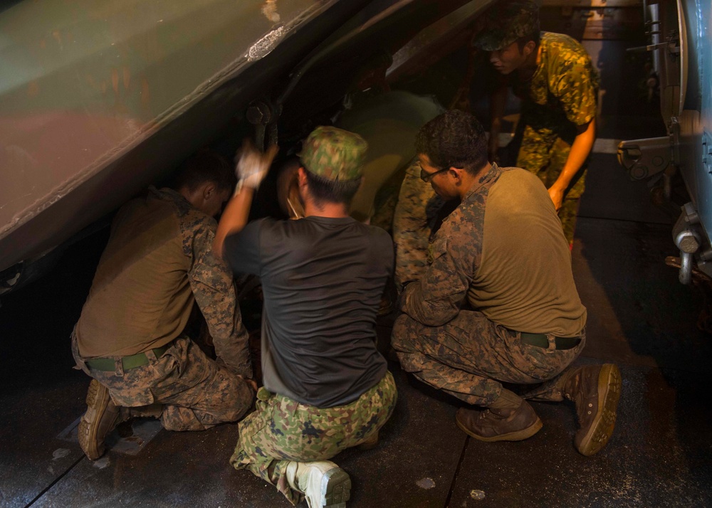 Marines attached to the 31st MEU and Soldiers from the JGSDF work together to secure an AAV