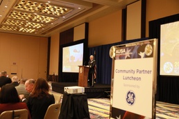 Perna addresses community partners