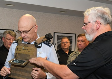 Lt. Gen. Arnold W. Bunch dons the Airborne Extensible Relay Over-the-Horizon Network concept combat tactical vest