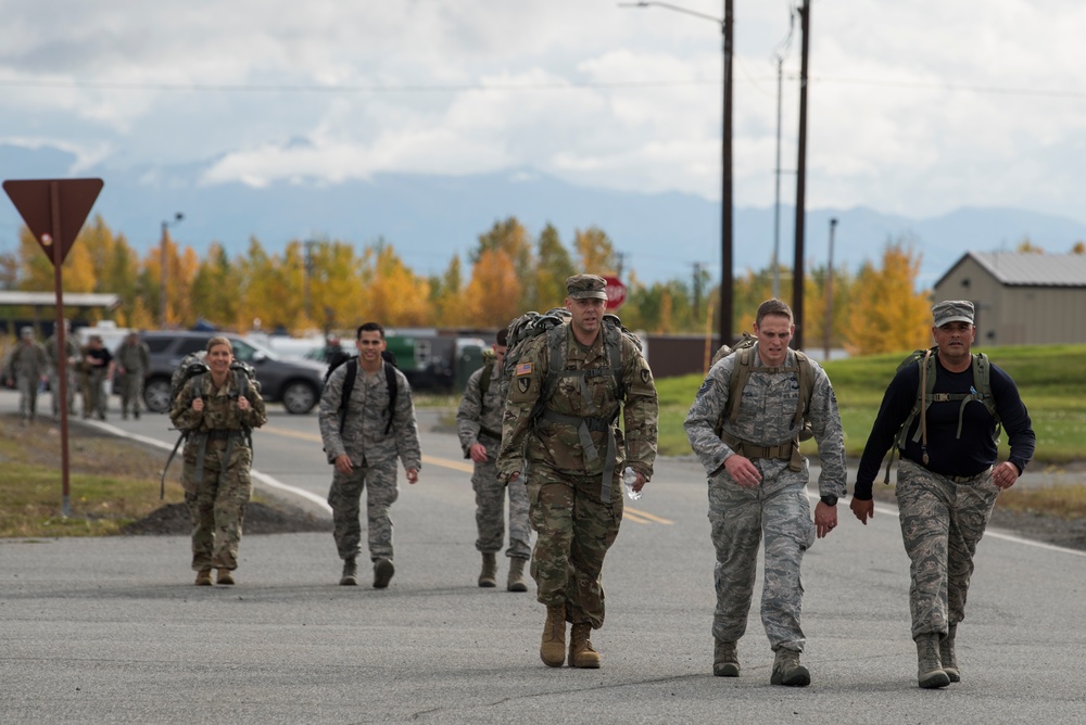 JBER commemorates POW/MIA through ceremony, ruck march and ASYMCA of Alaska food drive