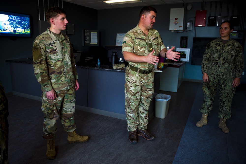 British Army Staff Sgt. David Donovan leads U.S. military color guard on Camp Lemonnier