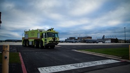A U.S. Air Force fire protection truck assigned to the 128th Air Refueling Wing Fire Department sits on the ramp ready for response