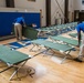 Setting up cots for Hurricane Michael evacuees