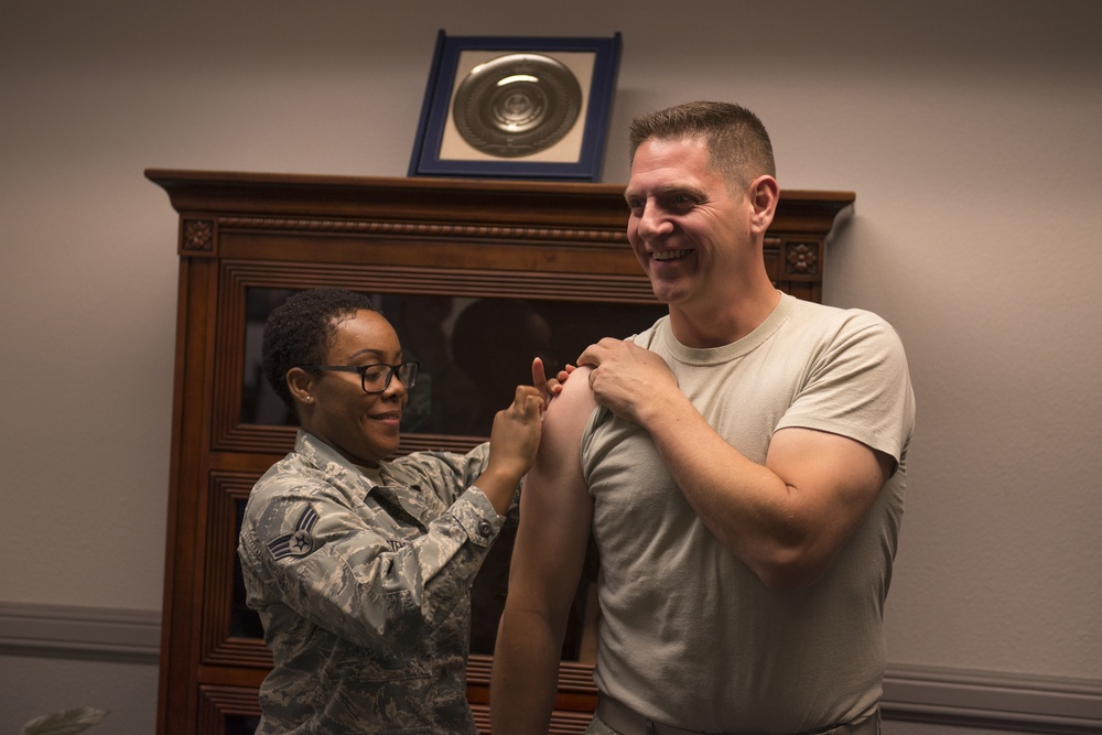 Col. Joe Kunkel, 366th Fighter Wing commander, receives an influenza