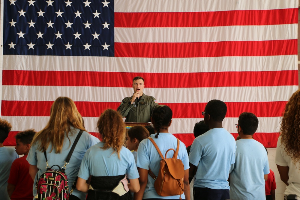 Lt. Benedict talks to middle school students about the importance of the Coast Guard Air Station's operations