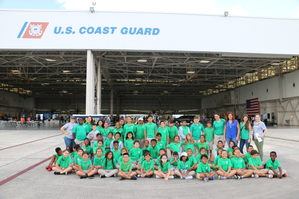 Middle school students take a group picture during the Air Station Miami open house