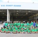 Middle school students take a group picture during the Air Station Miami open house