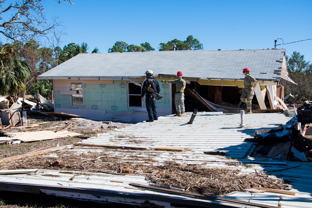 Florida National Guard 's CERF-P rescue teams search devastated neighborhoods in Gulf County