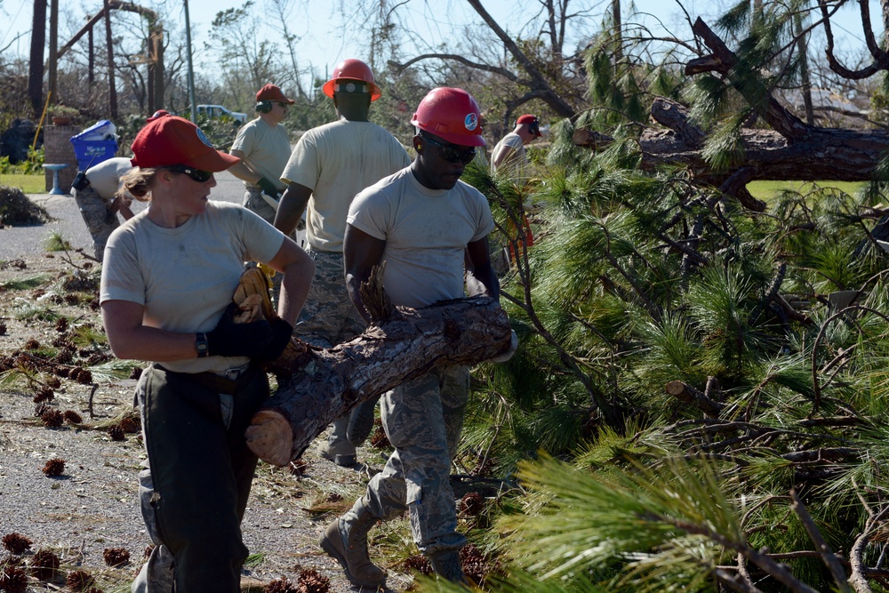Air Guardsmen Clean Streets of Trees and Branches