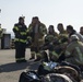 U.S. and NATO firefighters forge through the flames