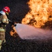 U.S. and NATO firefighters forge through the flames