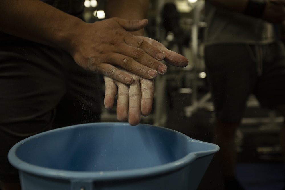 Make sure to stretch – Marines and Sailors compete in powerlifting competition aboard Wasp