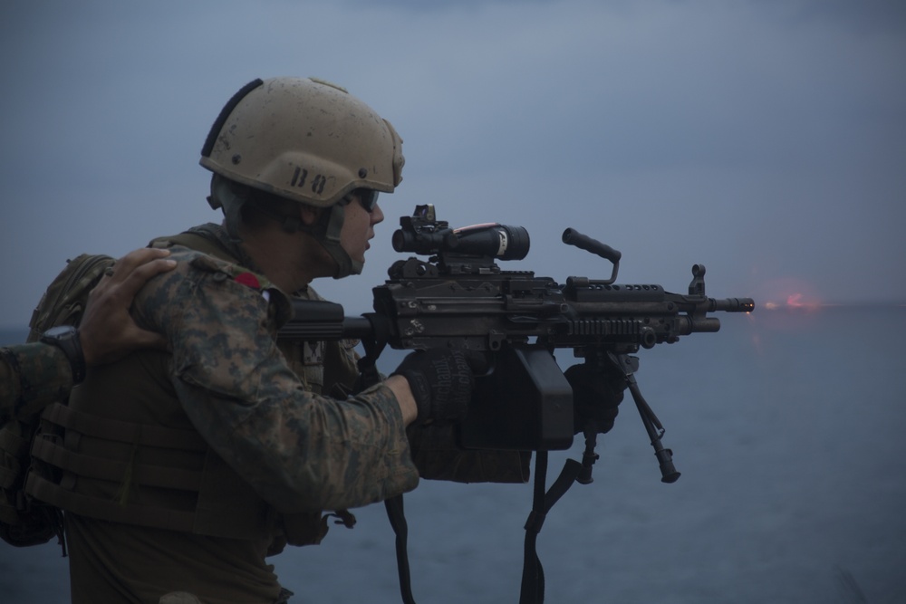 31st MEU recon Marines spit fire and lead during machine gun training aboard Wasp