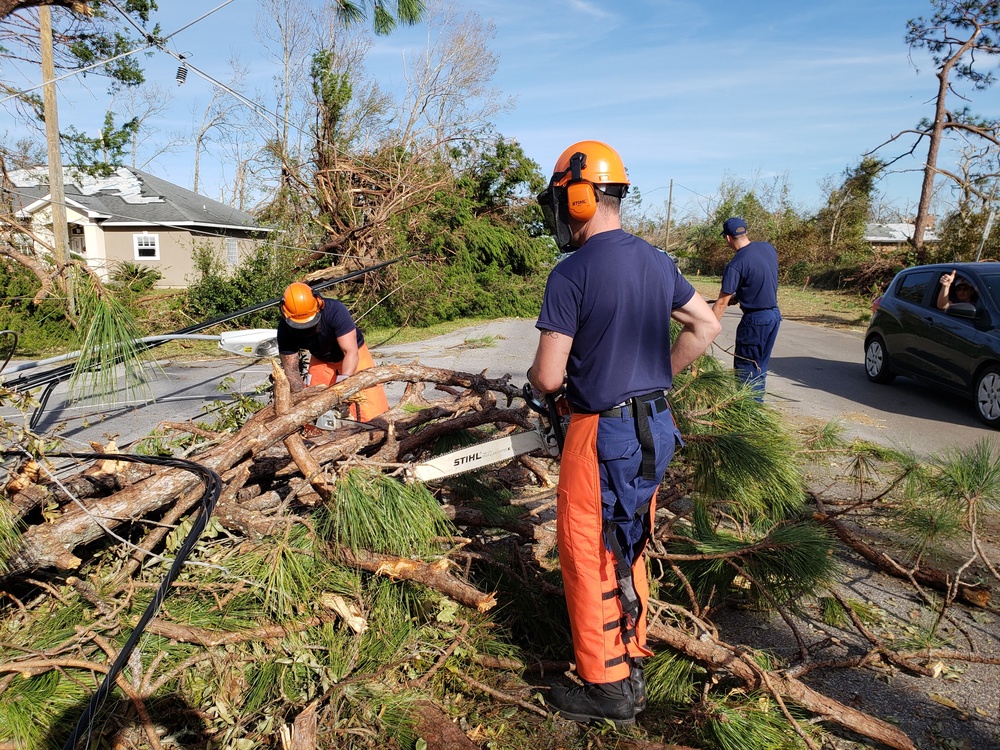 Coast Guard members help clear roads throughout North Western Florida after Hurricane Michael