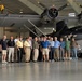 Naval Museum's volunteer corps in front of a PBY-5A