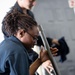 Sailors maintain machine guns aboard USS John C. Stennis