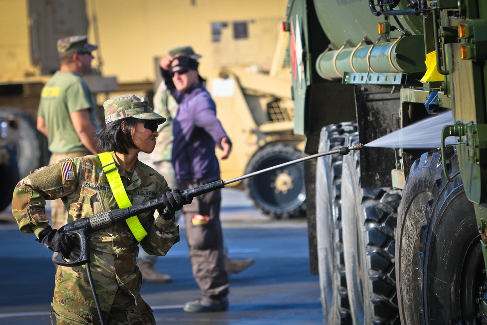 Working' At The Car Wash: Soldiers Prepare Vehicles For International Travel