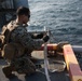 Weapons Company Marines fire machine guns aboard the Wasp