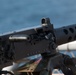 Weapons Company Marines fire machine guns aboard the Wasp