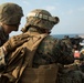 Weapons Company Marines fire machine guns aboard the Wasp