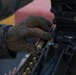 Weapons Company Marines fire machine guns aboard the Wasp