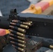 Weapons Company Marines fire machine guns aboard the Wasp